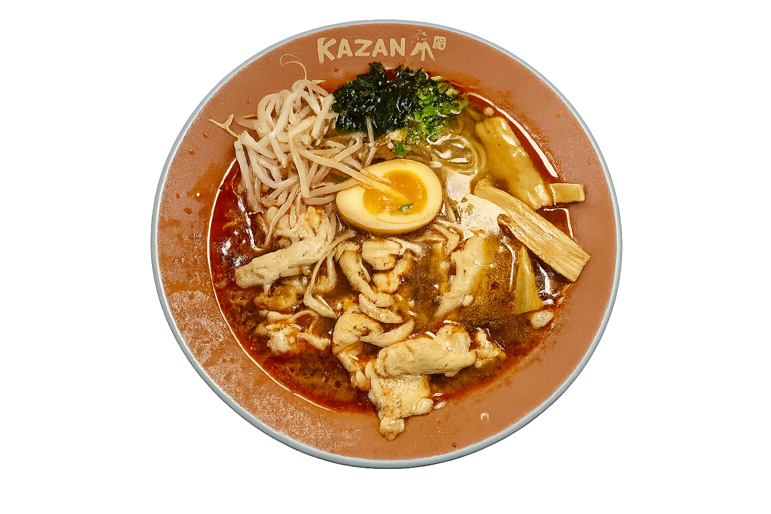A bowl of ramen with sliced chicken, a halved soft-boiled egg, bean sprouts, chopped green onions, seaweed, and bamboo shoots in a ramen bowl titled 'KAZAN'.