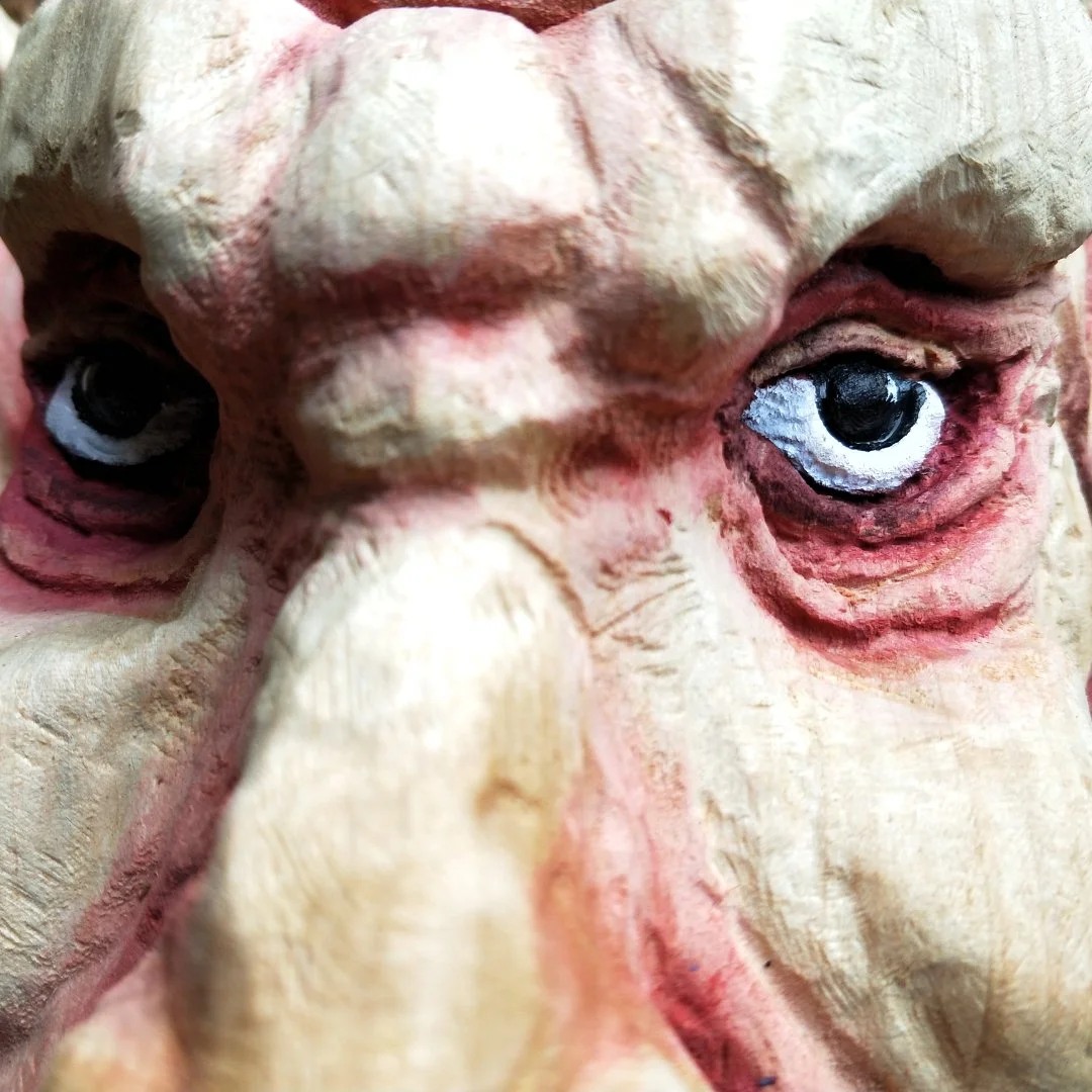 chainsaw carving wood sculpture Australian artist goblin face portrait eyes