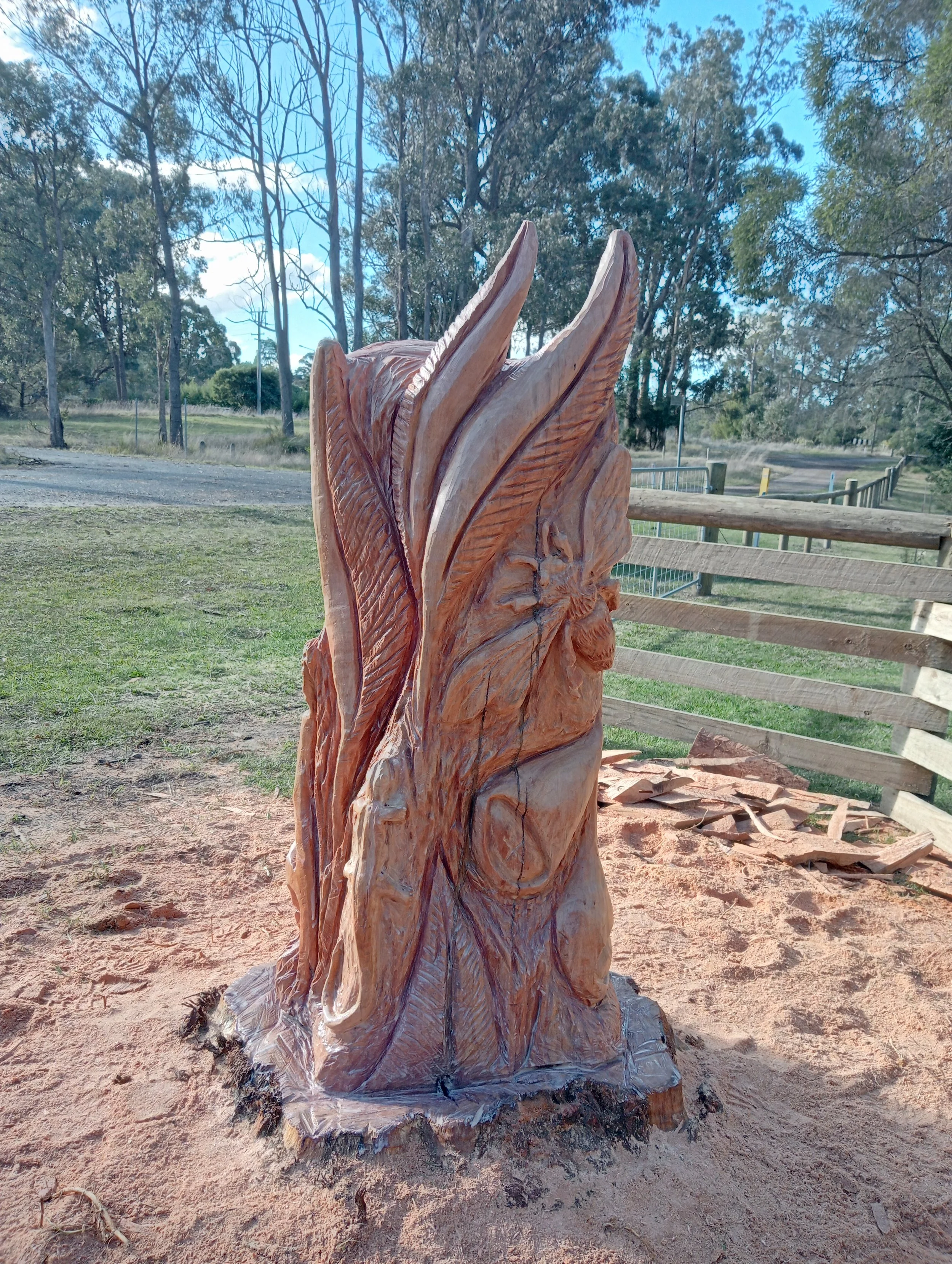 chainsaw carving wood sculpture Australian ironbark gum tree bees