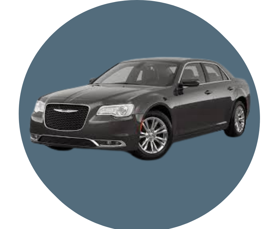 A black sedan car with a Chrysler logo on the front grille.