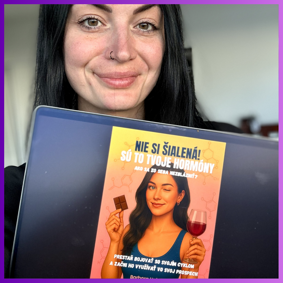 Published author Barbora Hojdikova posing with her book about female biology