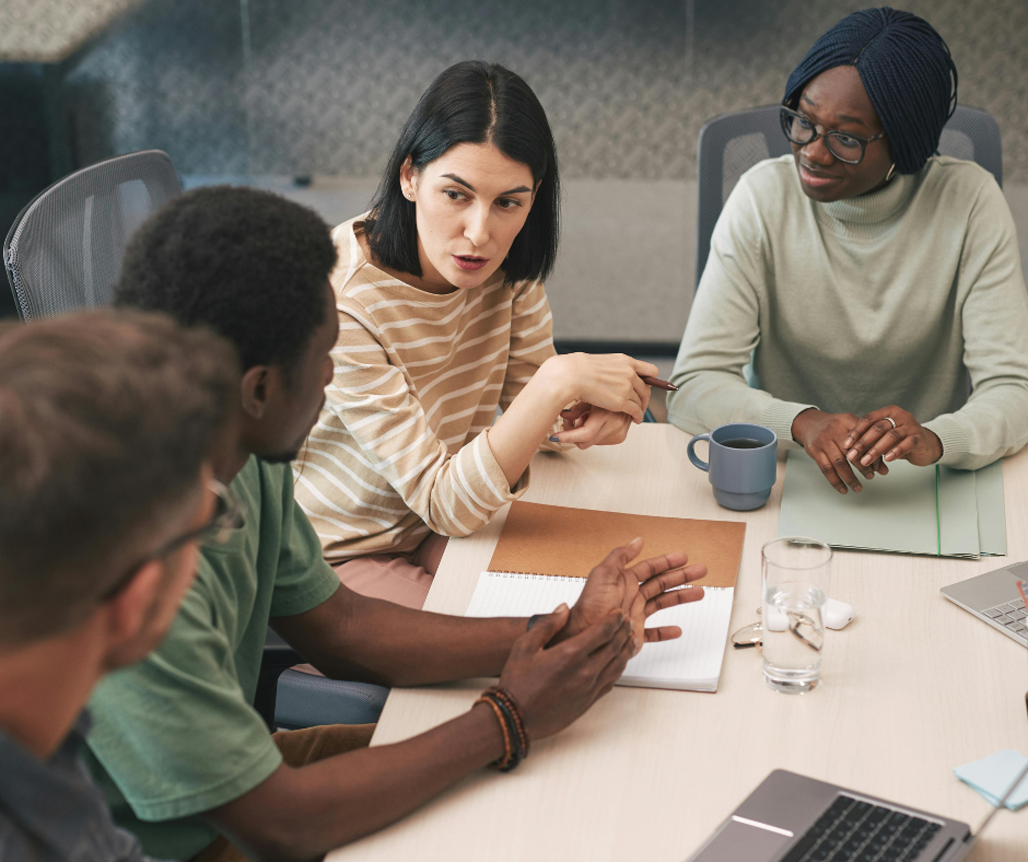 Group of diverse people having a discussion in a meeting room.