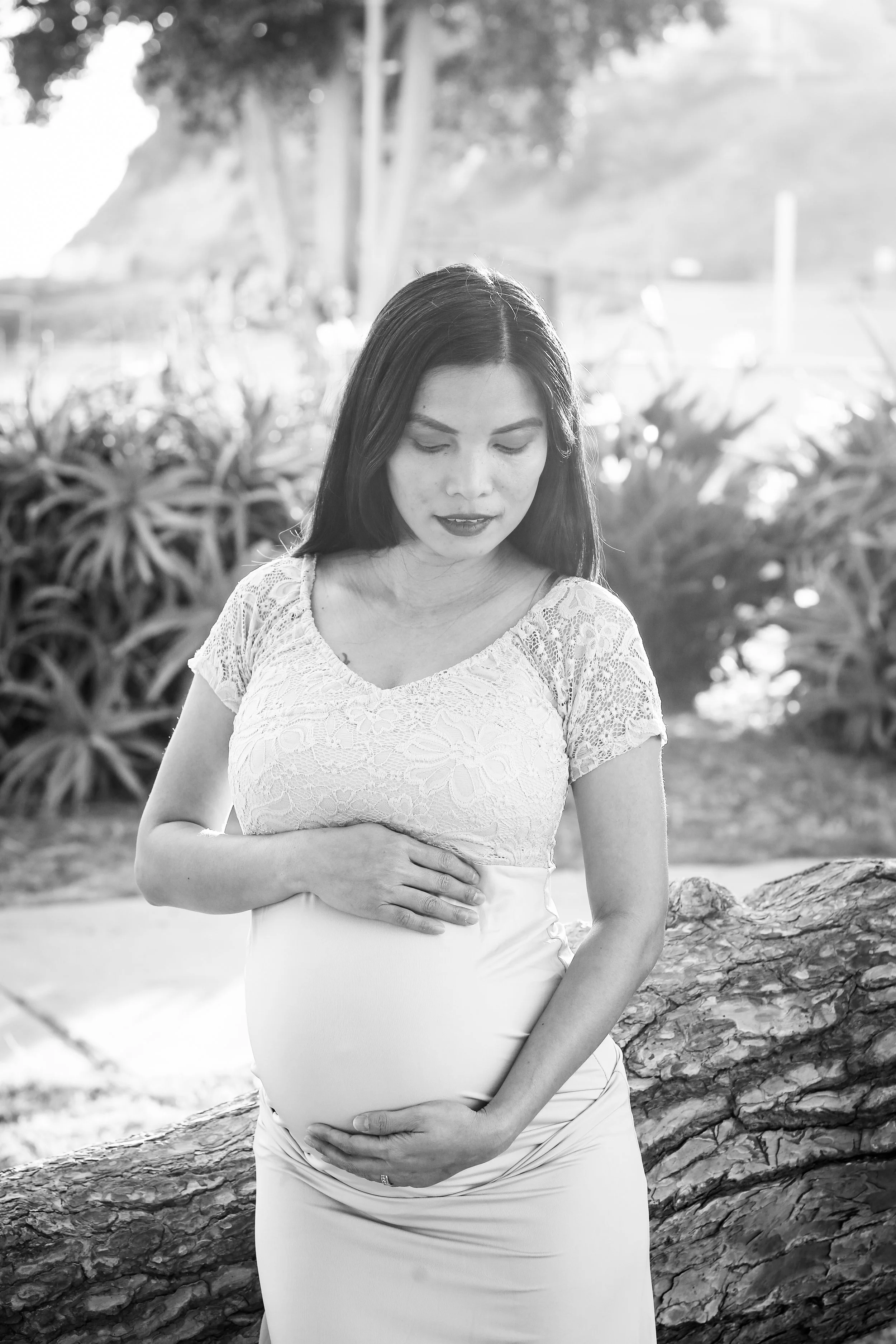 Jhem cradles her belly