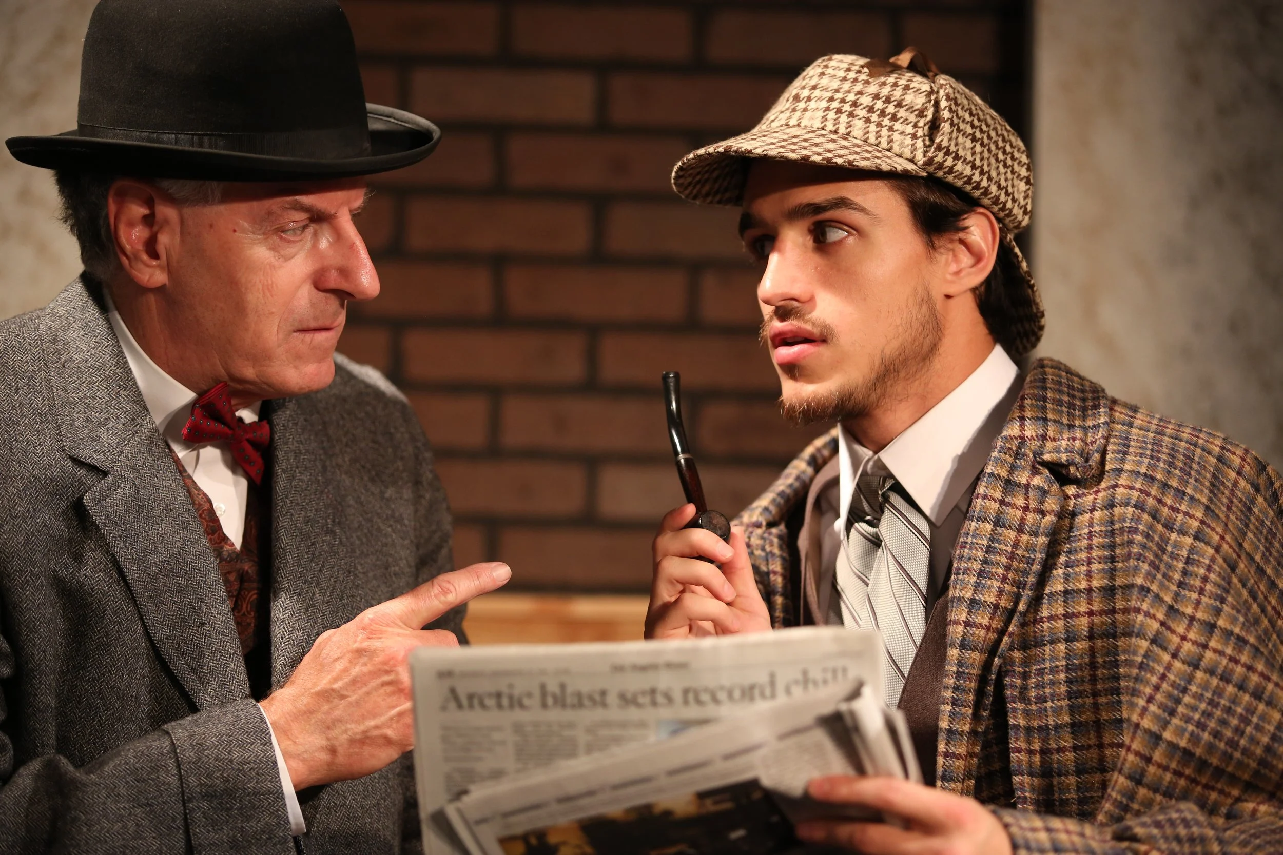 Sherlock and Watson discuss a clue in the paper at the Long Beach Shakespeare Company