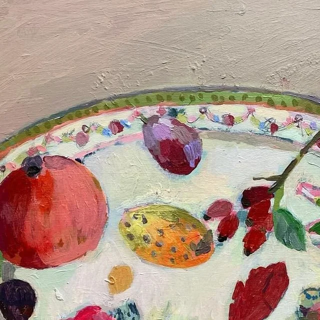 Close-up of a painted fruit bowl with various fruits including berries, a small orange fruit, and a purple-blue fruit.