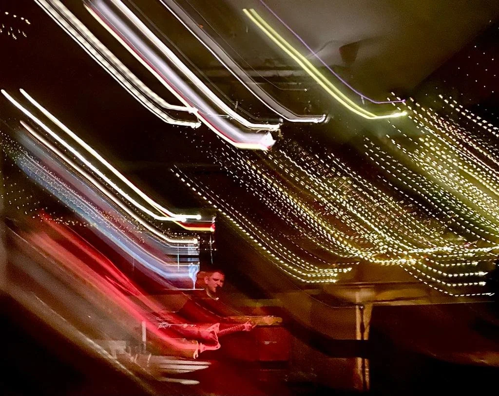 Mike Nisbet playing guitar live