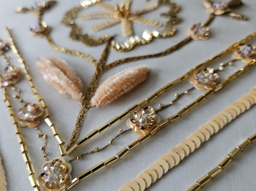 Tambour embroidery using beads, sequins, raffia and chenille thread.