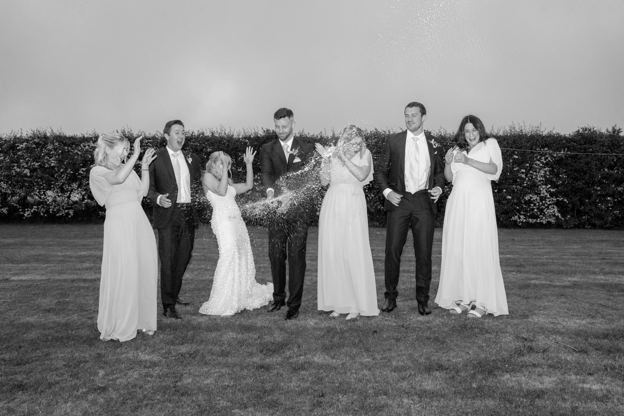 gemma-wythe-photography-black-and-white-champagne-spray-moment..jpg