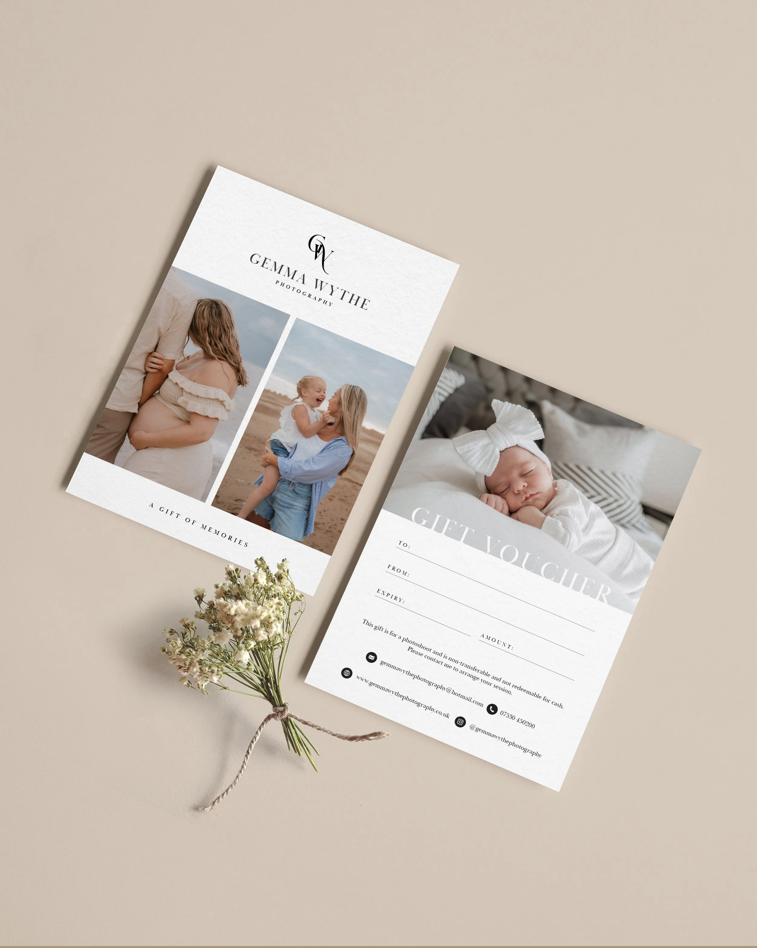 Gift voucher and photography brochure with photos of children and family, placed on beige surface with small white flowers.