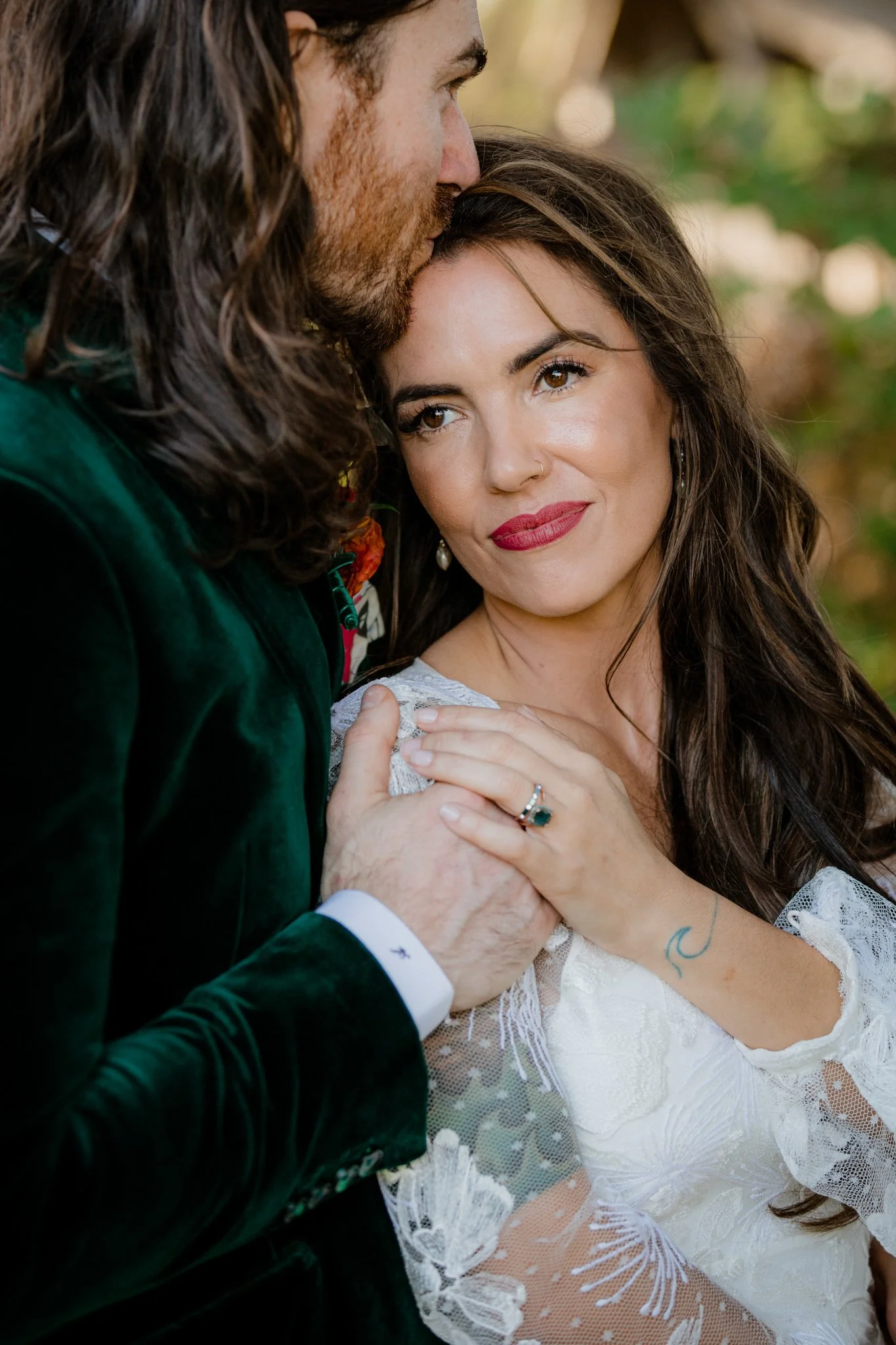 Dune kisses the top of Lindseys forehead and she leans into him during a portrait session