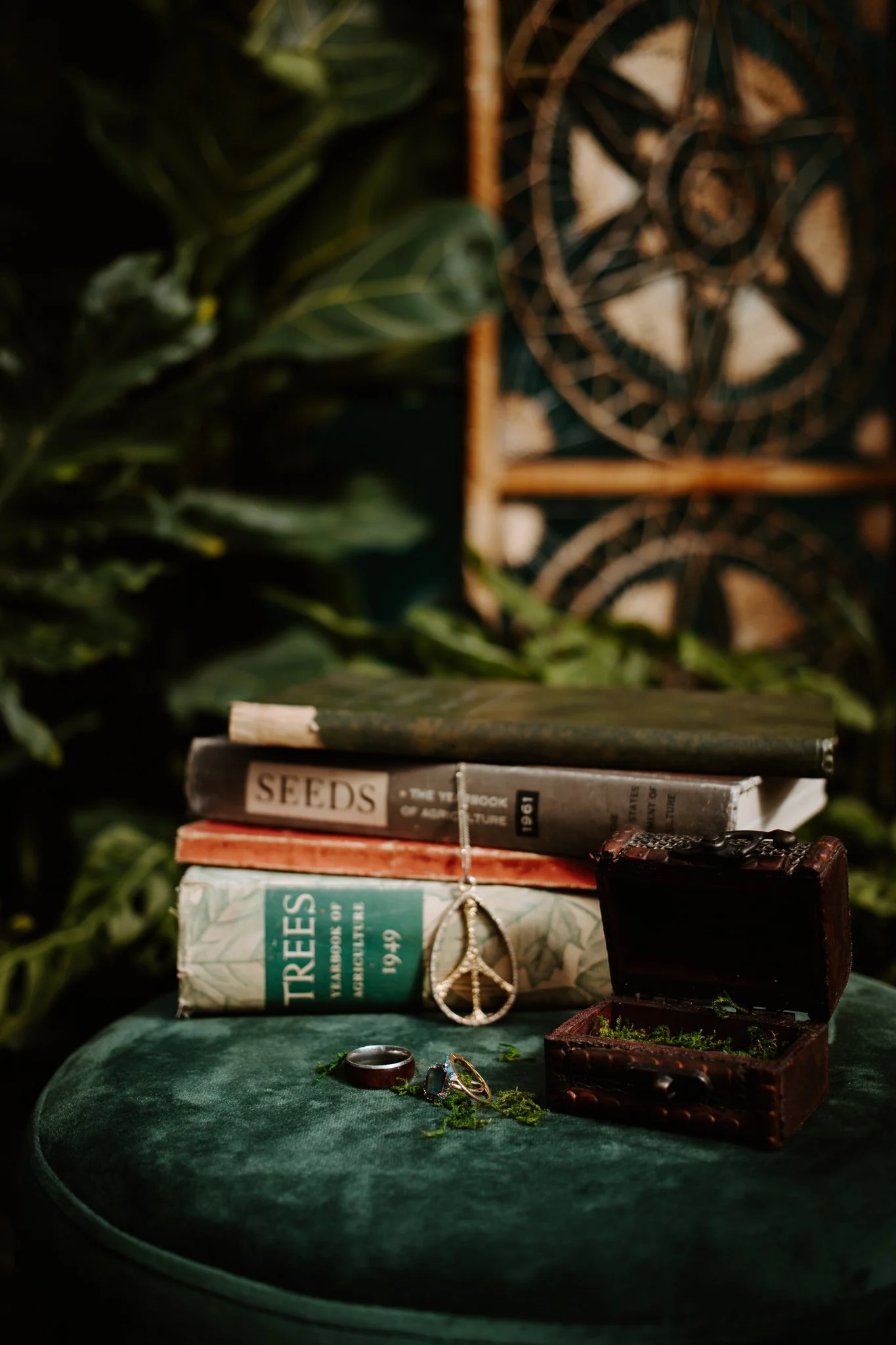 Lindsey's important details hang from old books and rest on a green stool.