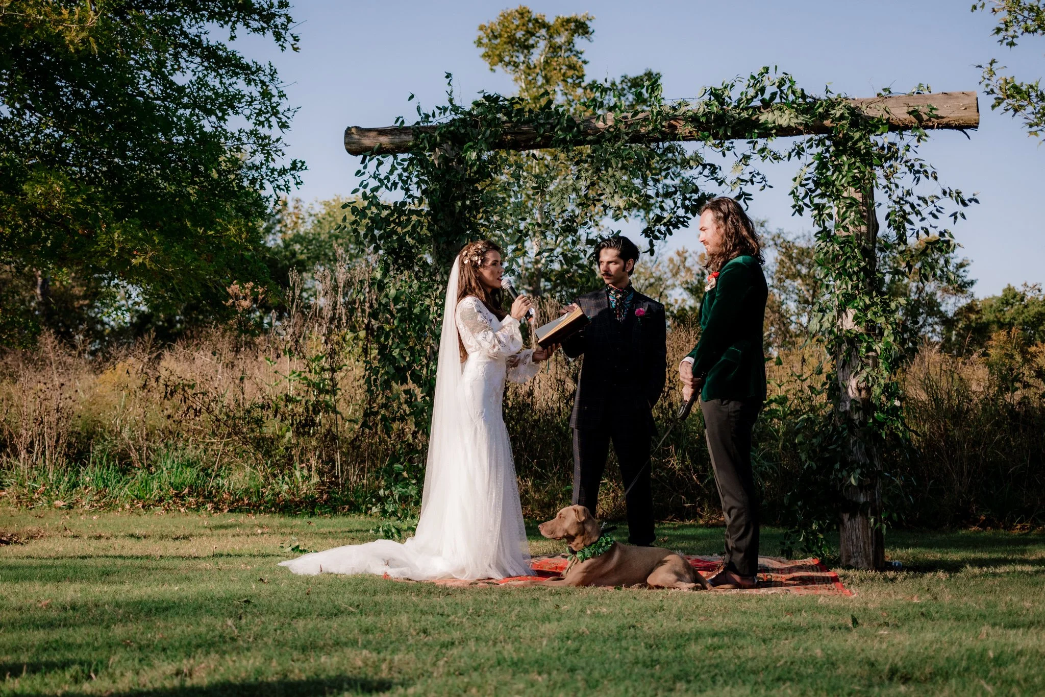 Linsey, Dune and their dog at the alter.