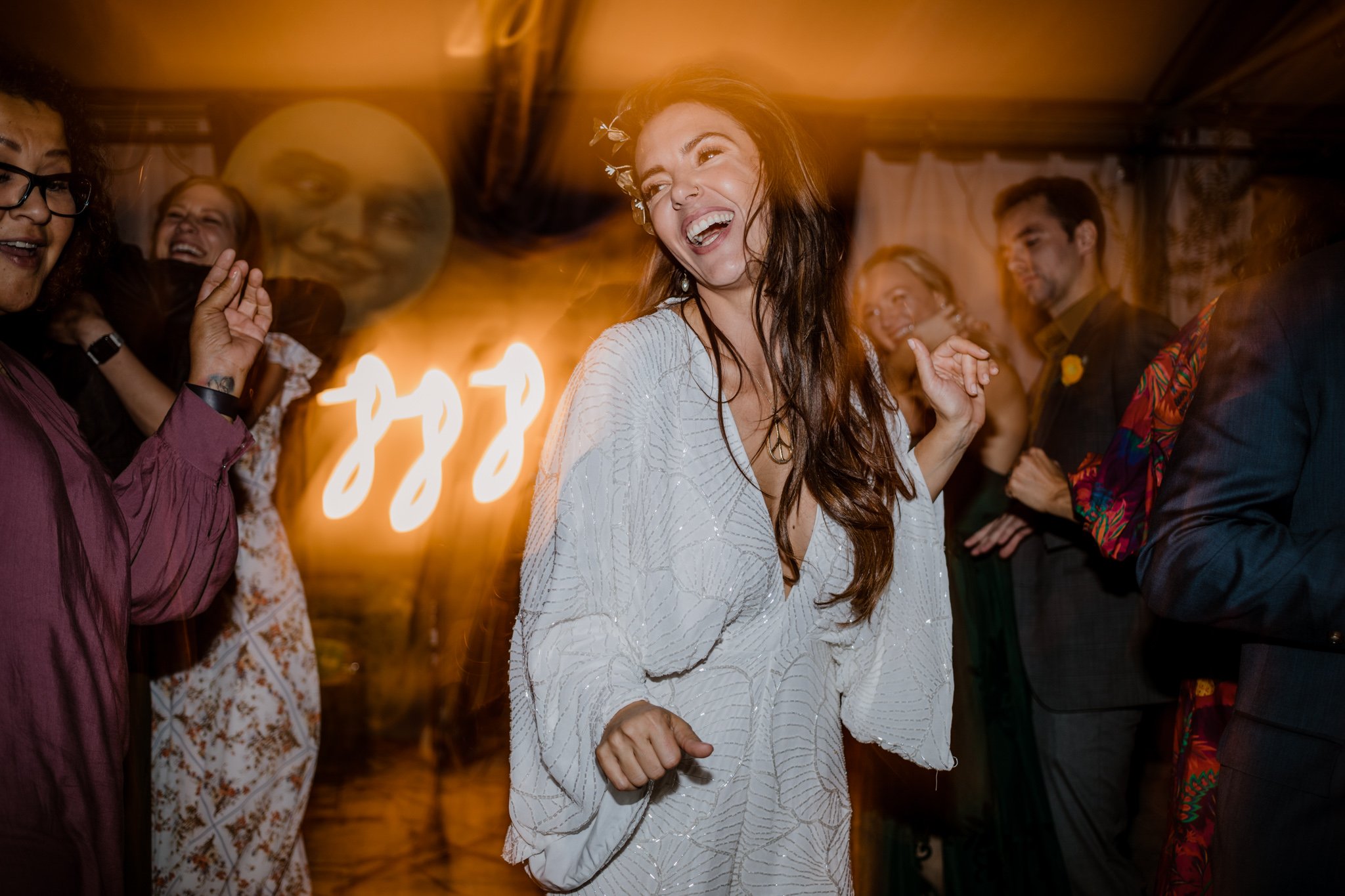 Lindsey laughs as she dances on her dance floor, in her second dress of the evening