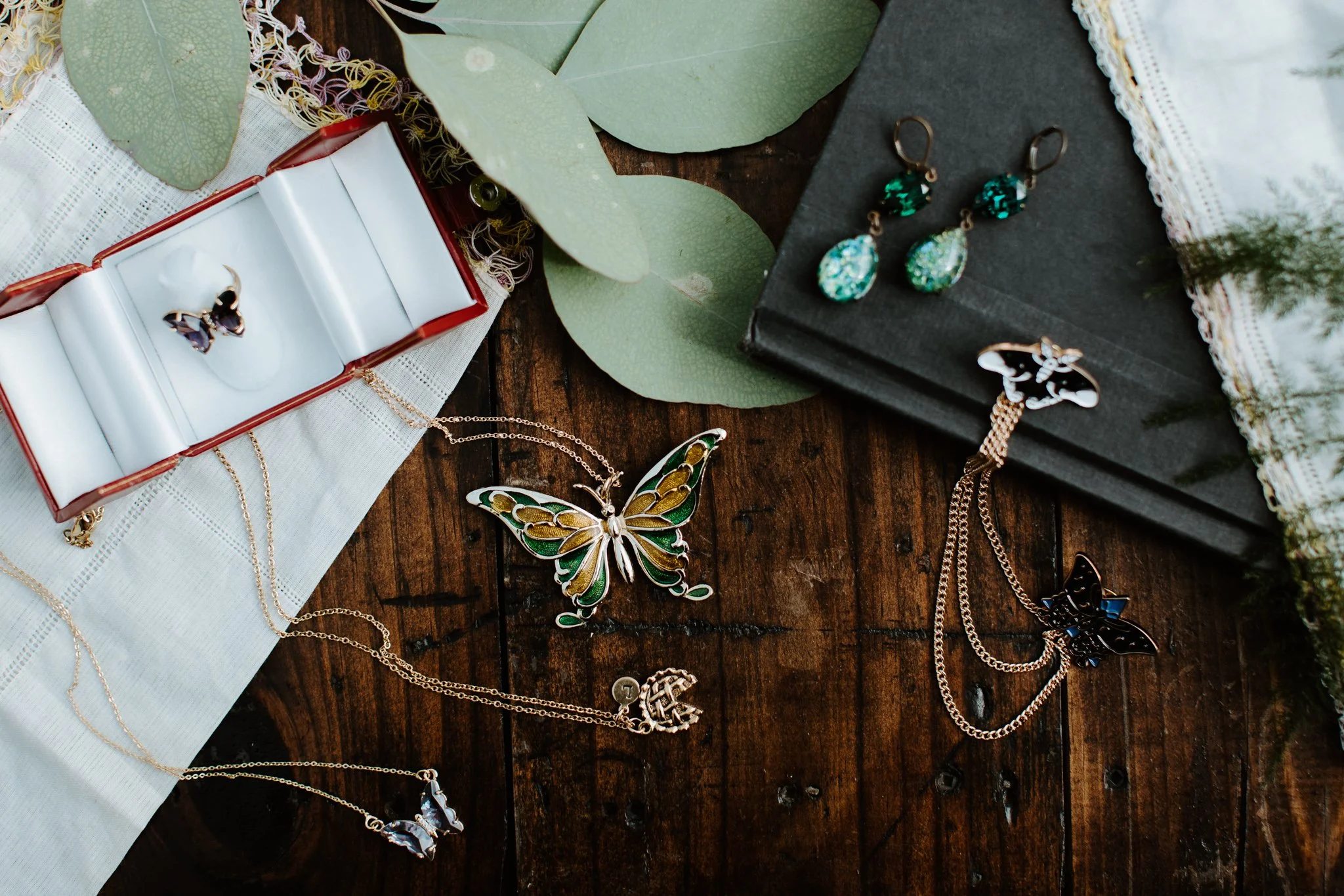 Wedding gifts for children lay across a wooden backdrop