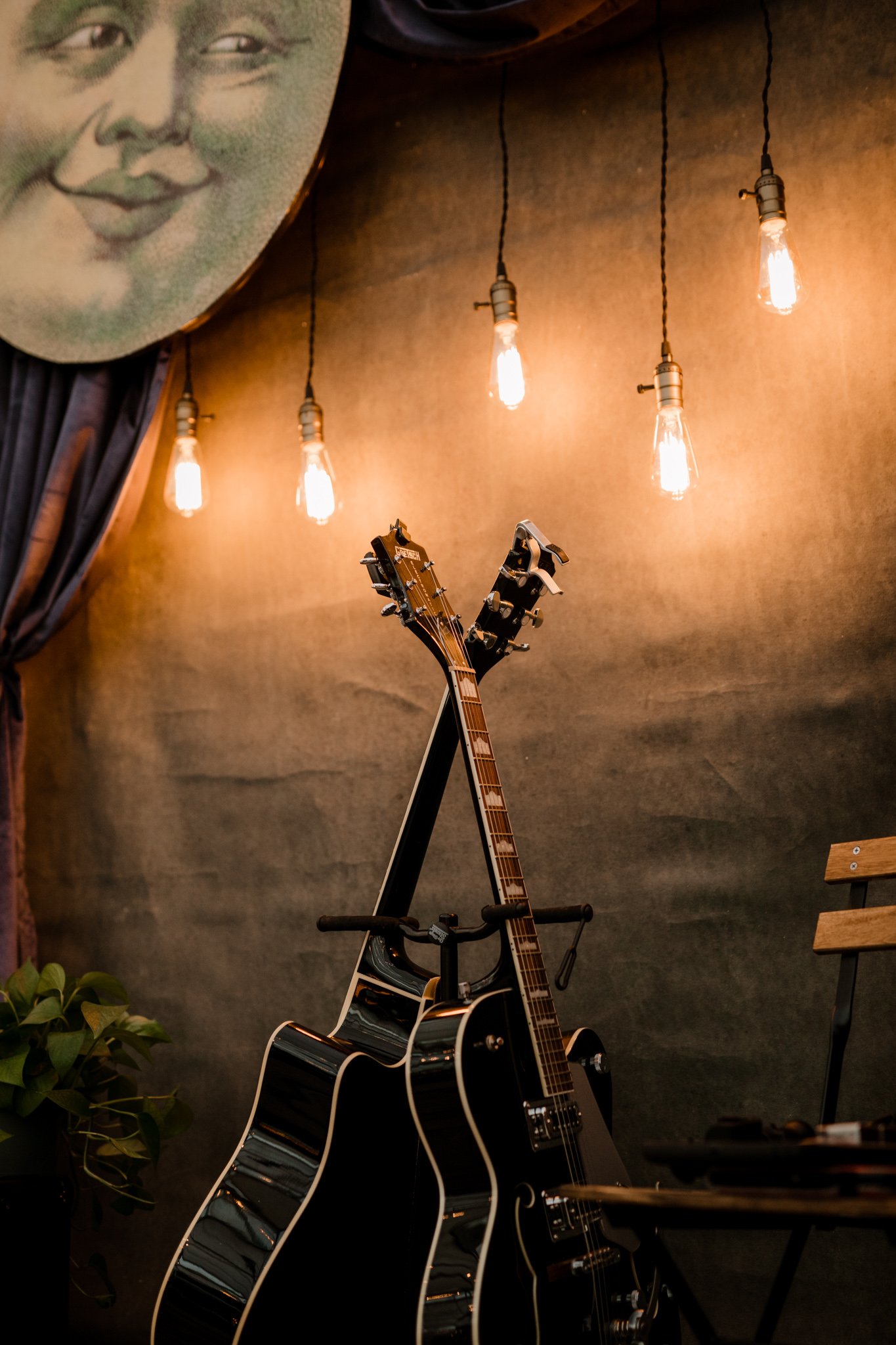 The stage set for the talent show, with a hand painted moon in the corner and two guitars waiting to be played.