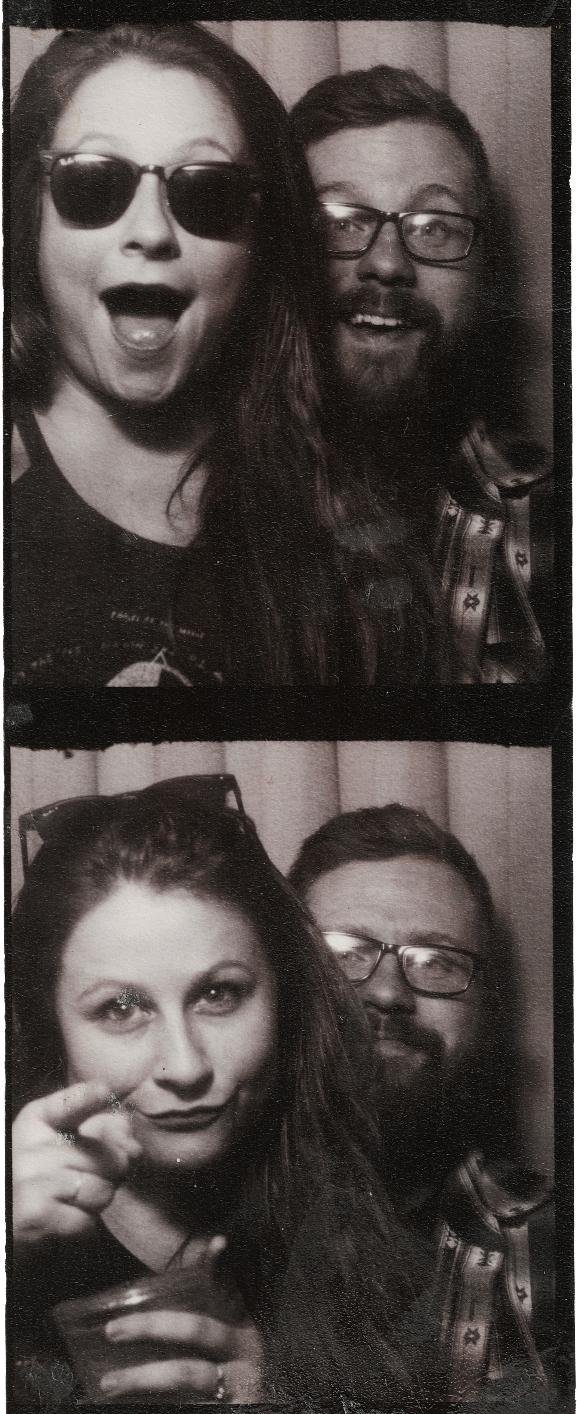 Paige and Corey of Going Home Co in two photo booth pictures. Woman with dark hair and light skin, and a man with glasses and long hair, against a striped background.