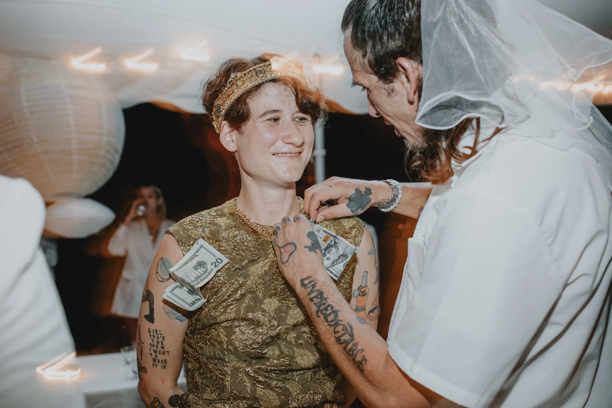 Cai has money pinned to her, during a New Orleans tradition
