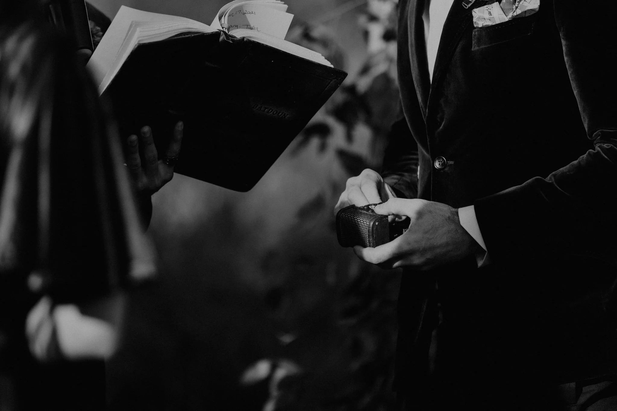 Dune pulls the ring from it's ring box during the ceremony.