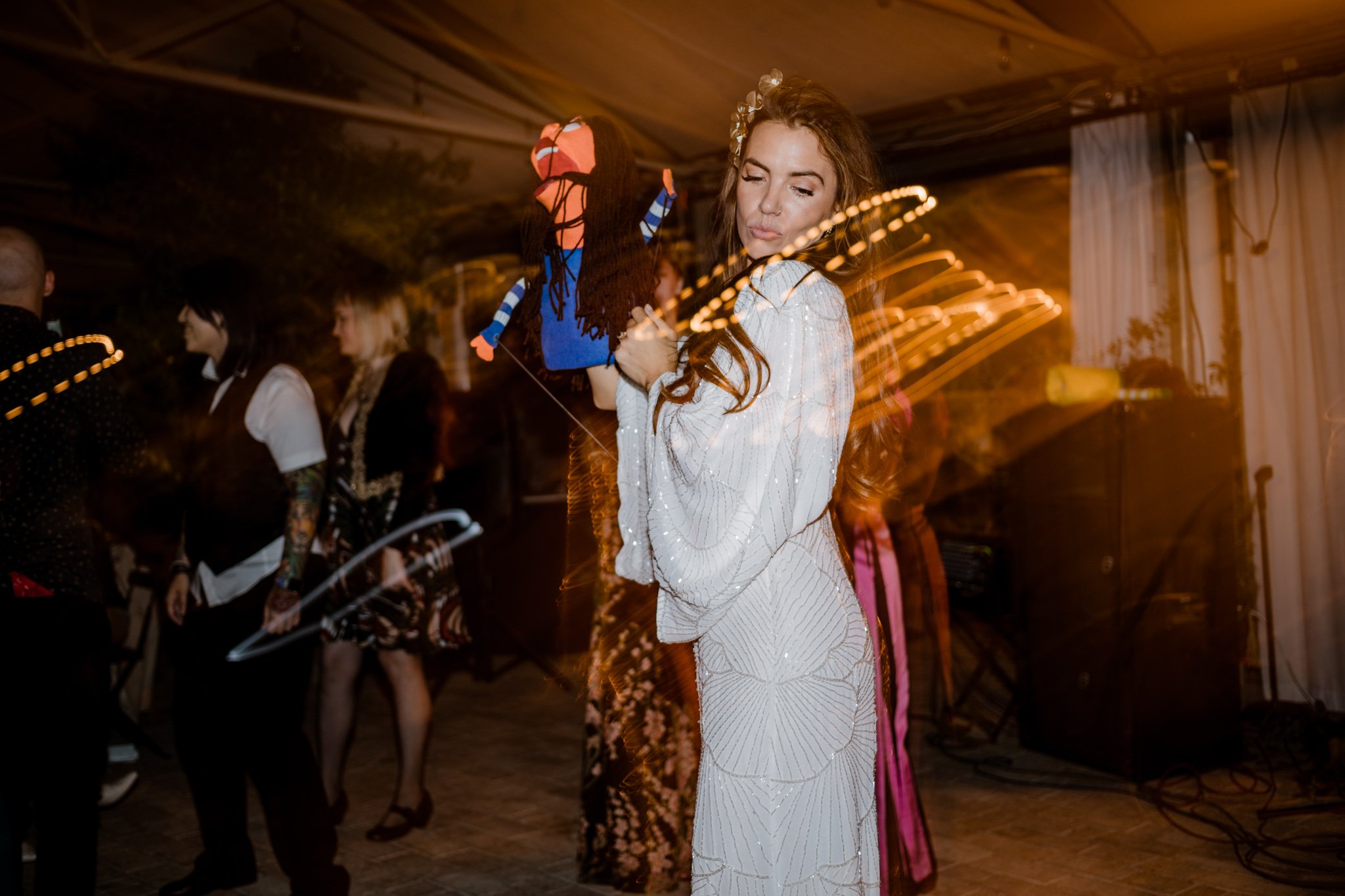 Lindsey dances with the custom puppet that was made to represent her.