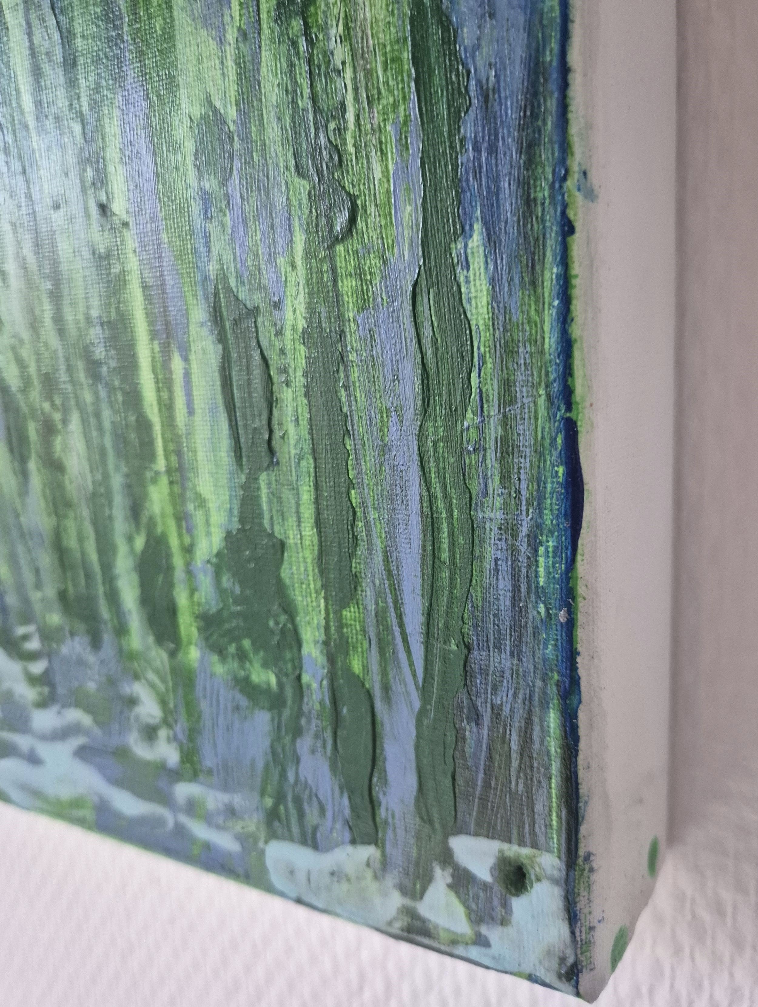 Close-up detail of the painting’s edge, showing layered paint and material thickness.