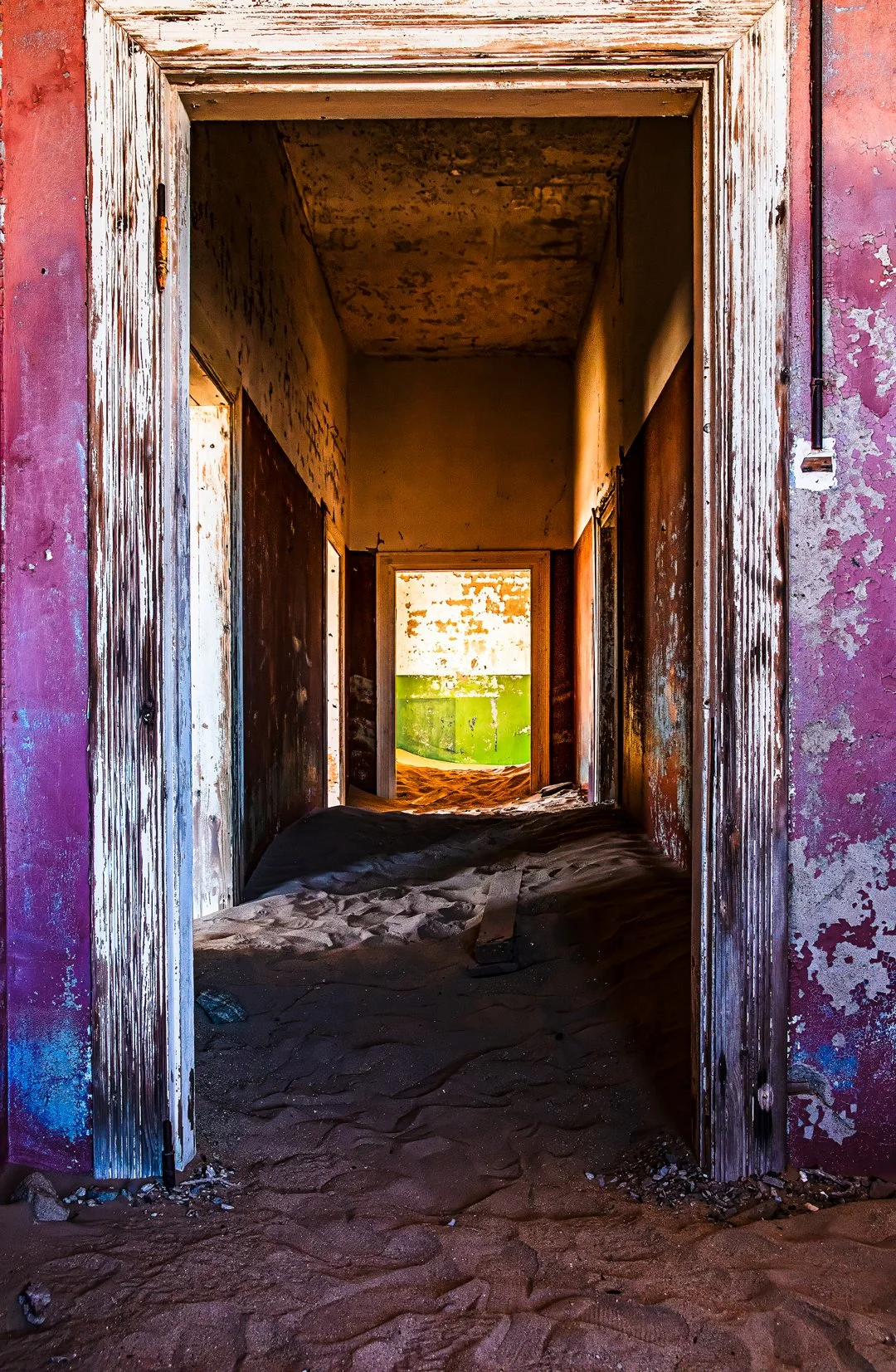 Pink walls frame a green ghost