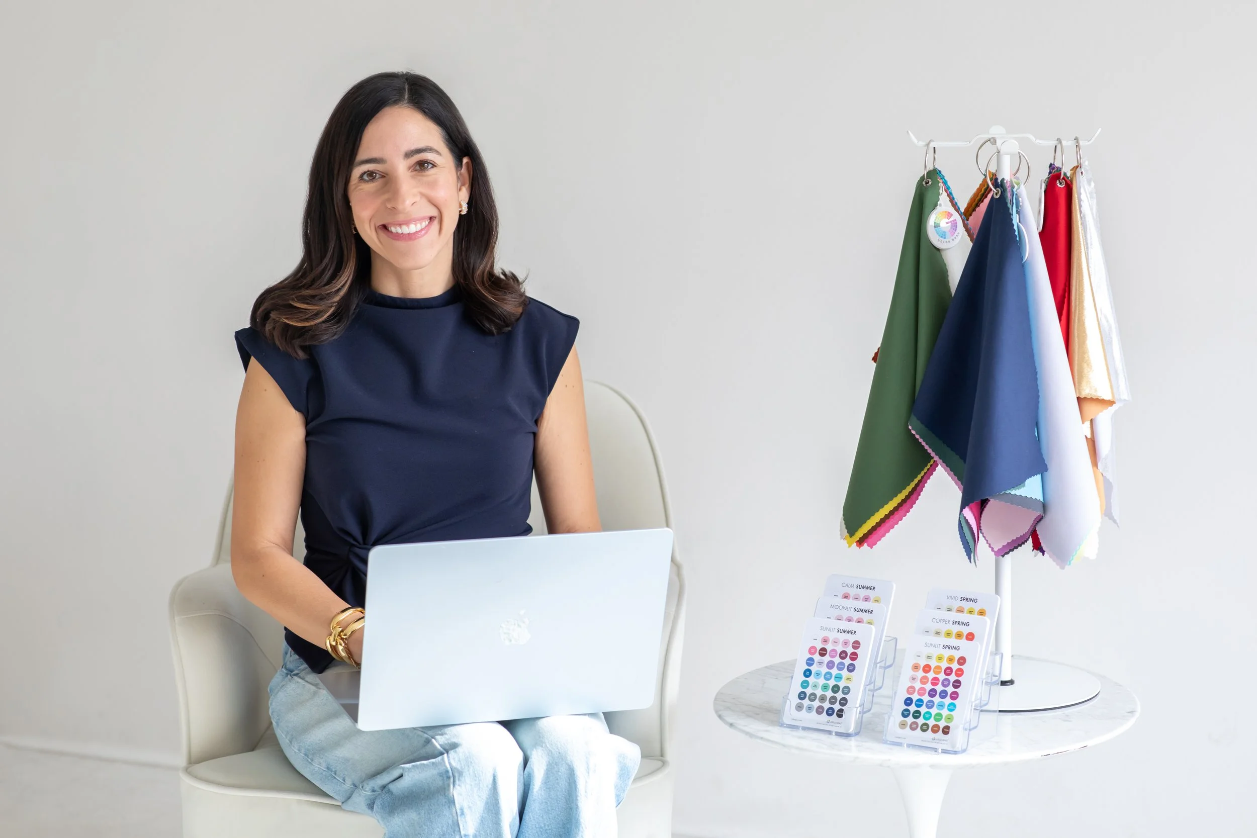 Kristin on a laptop waiting for a color analysis client in philadelphia