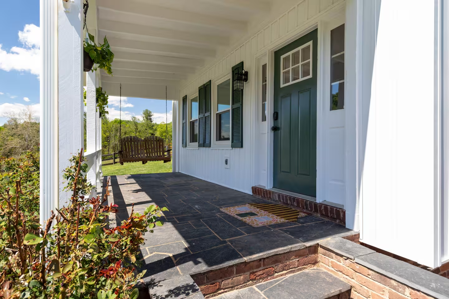 51-the-heritage-house-front-porch-swing.png