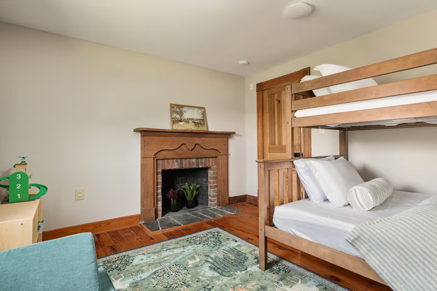 26-the-heritage-house-bunk-room-fireplace.png