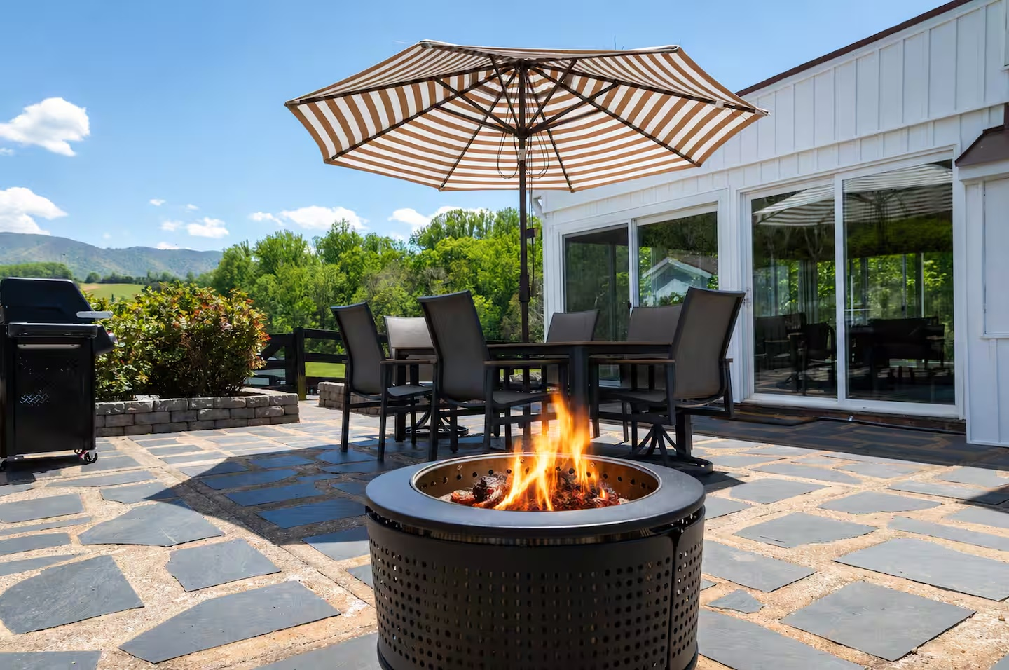 61-the-heritage-house-patio-fire-pit-dining-area.png