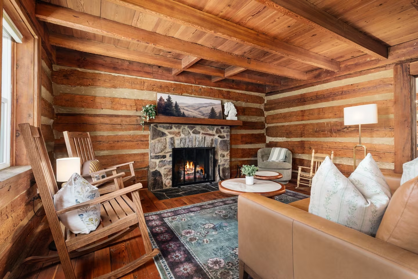 63-the-heritage-house-log-cabin-living-room-fireplace.png
