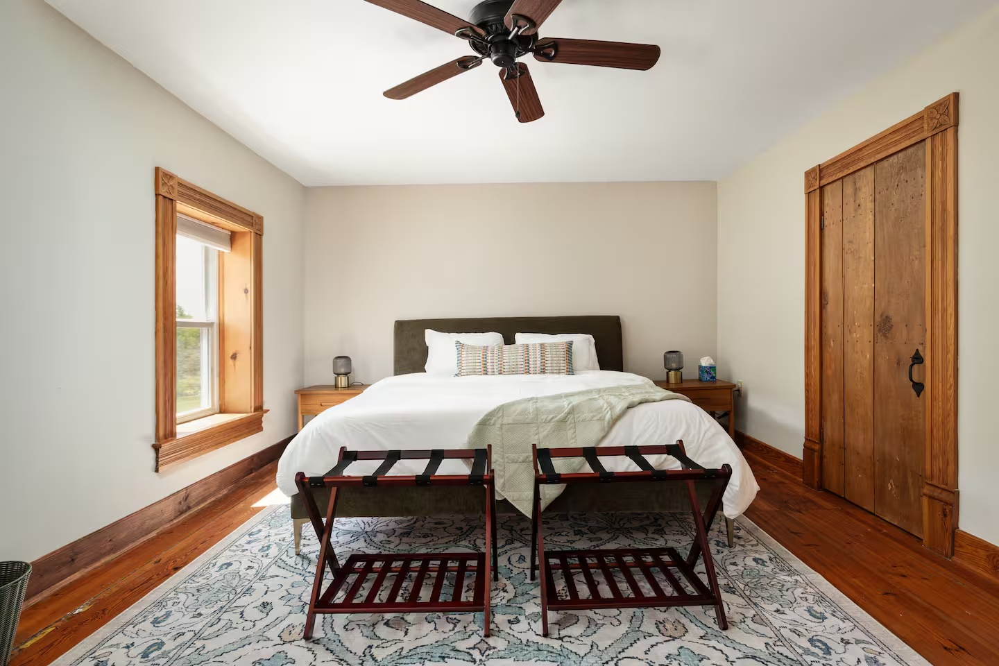 23-the-heritage-house-primary-bedroom-luggage-racks.png