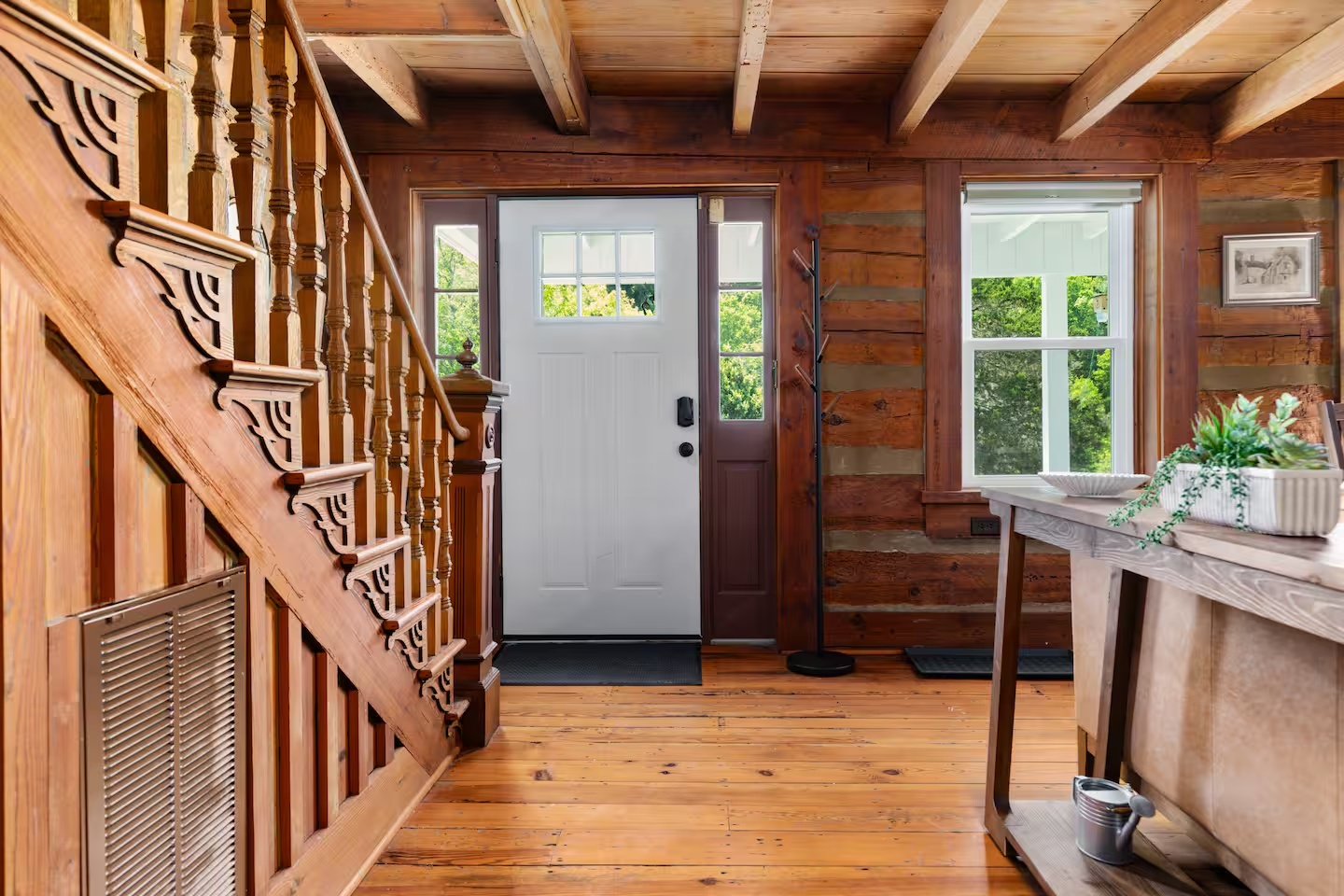 31-the-heritage-house-wood-entry-staircase.png