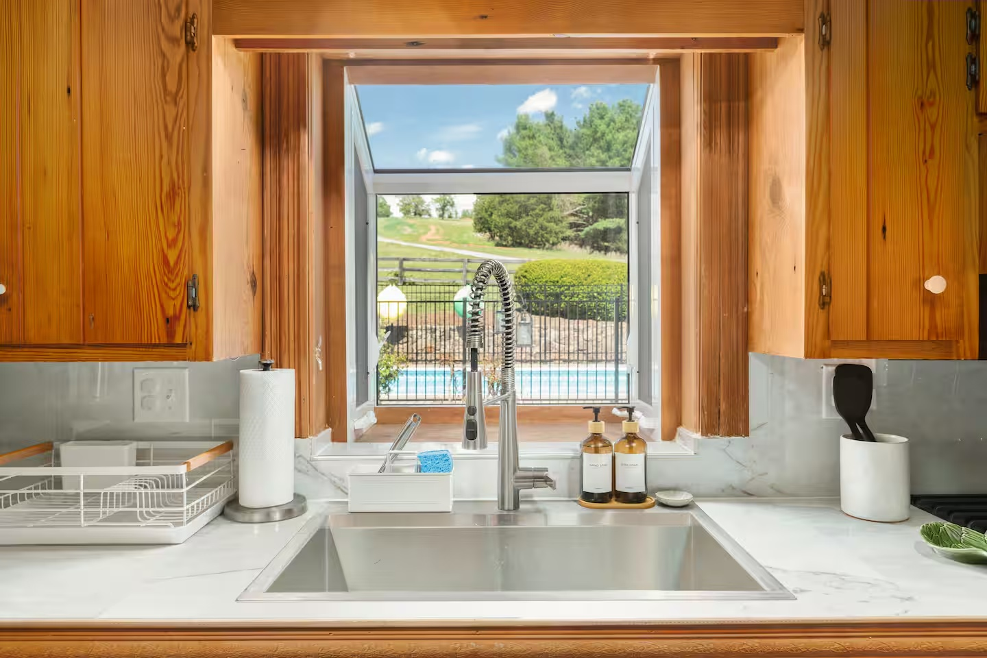 40-the-heritage-house-kitchen-sink-pool-view.png