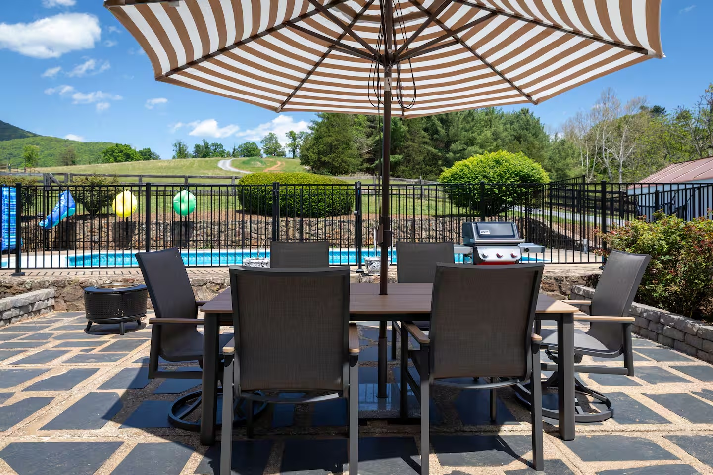 54-the-heritage-house-patio-dining-pool-view.png