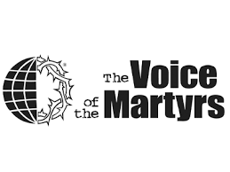 Logo of The Voice of the Martyrs featuring a globe with a lion's head and the text