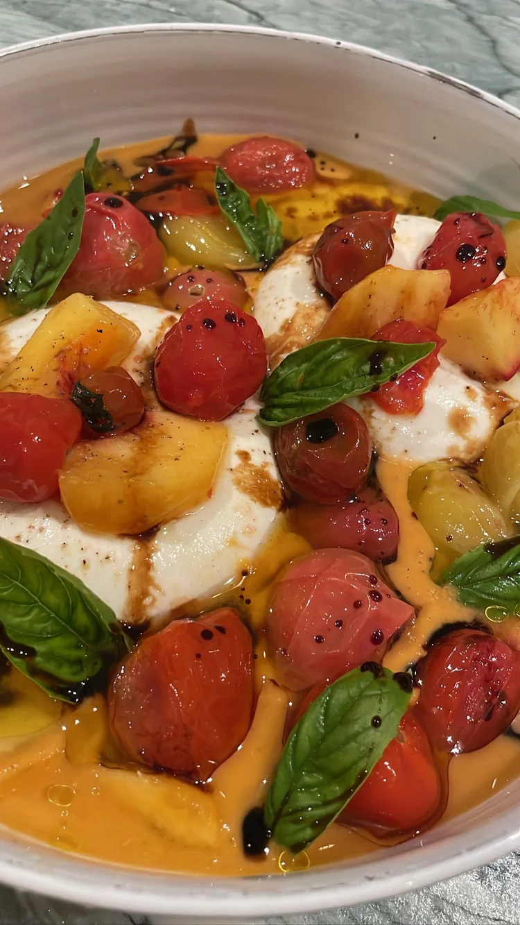 Caprese with cherry tomatoes, basil and mozzarella
