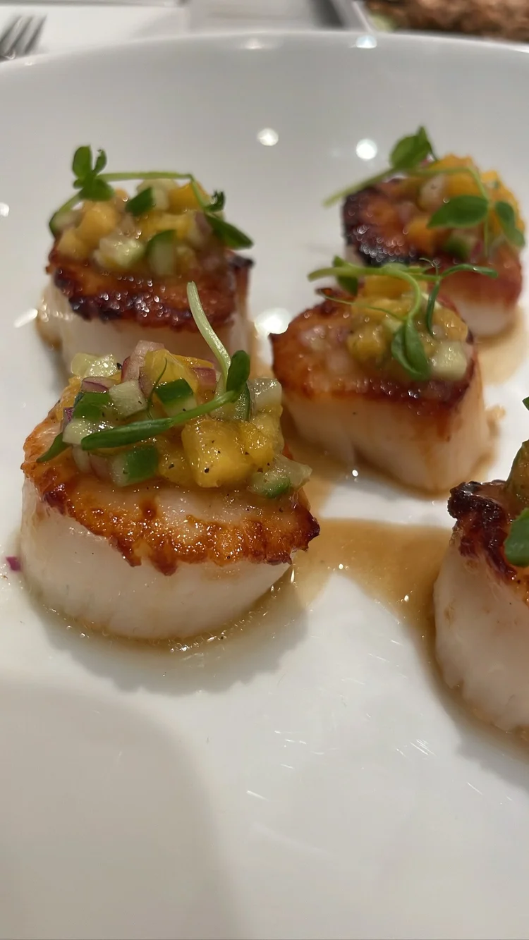 Seared scallops with pineapple and microgreens