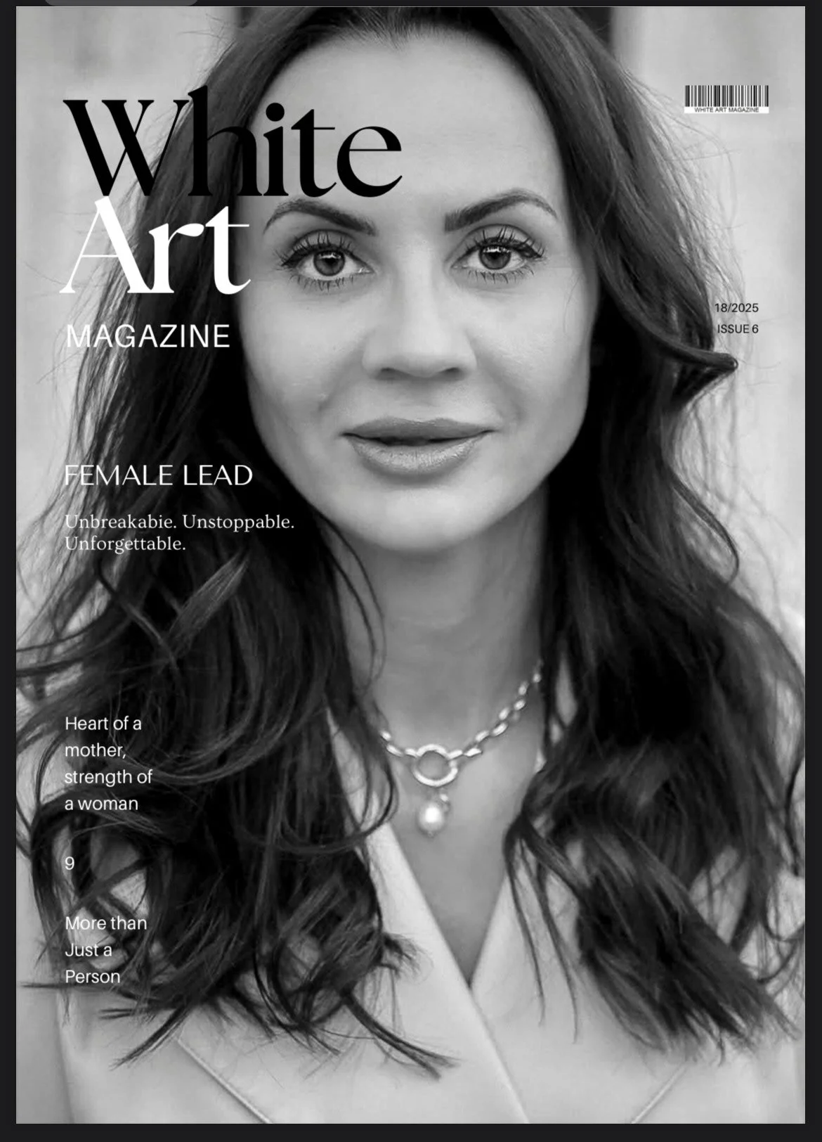 A black and white cover photo of a woman with wavy hair, wearing a necklace with a pendant, on the cover of White Art Magazine. The cover includes headlines about female leadership and strength.