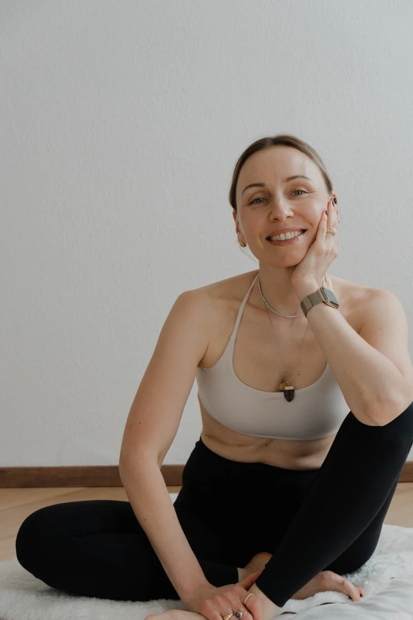 Woman sitting in a meditative position - hollistic approach to your business, seeing the whole picture - the business and you a person