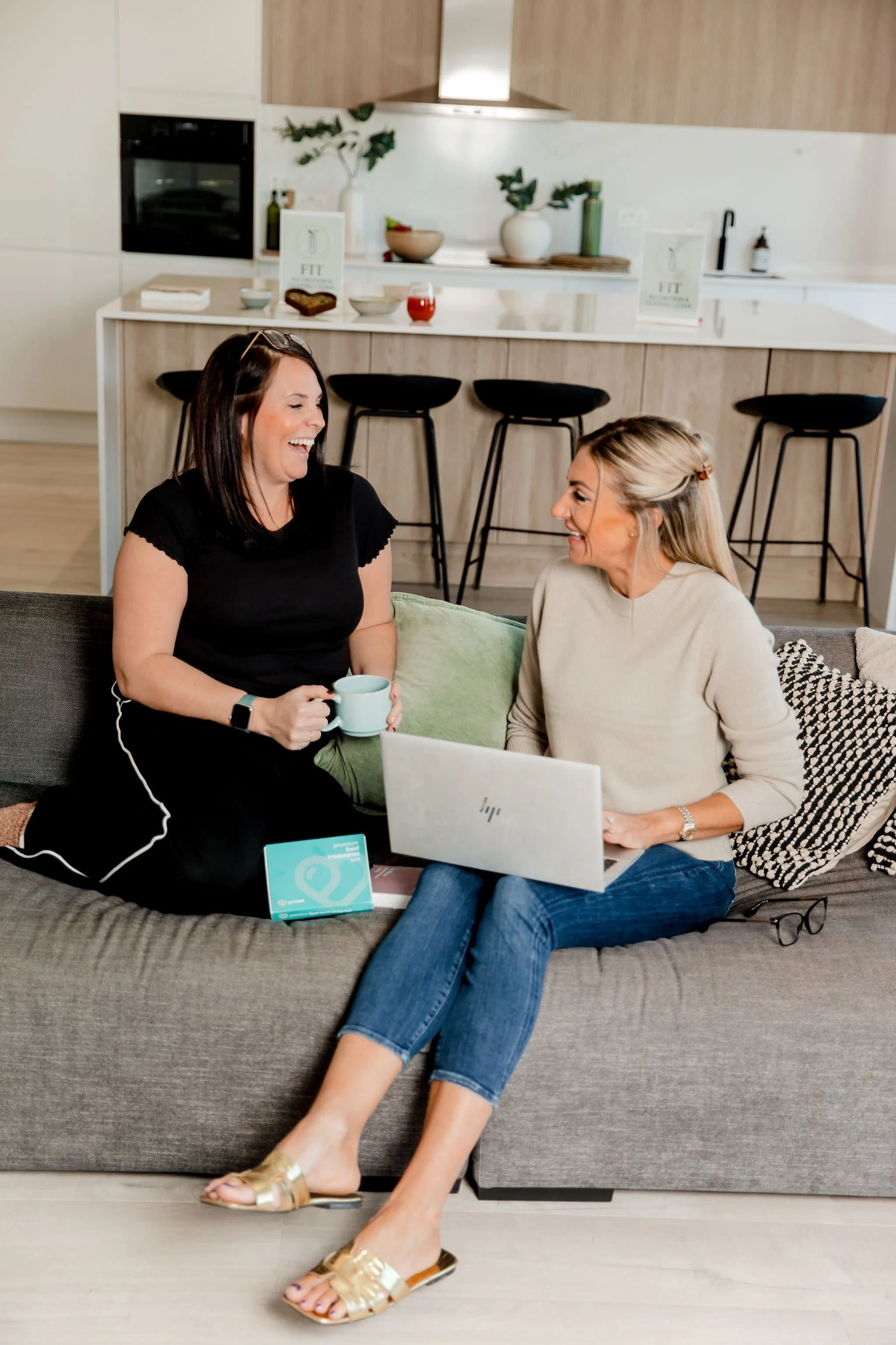 becki Hawkins and client chatting while looking at test results on laptop