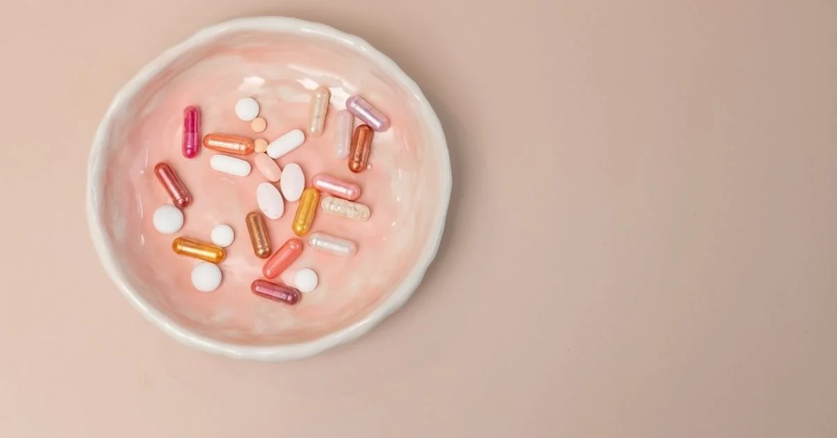supplements on a small pink plate