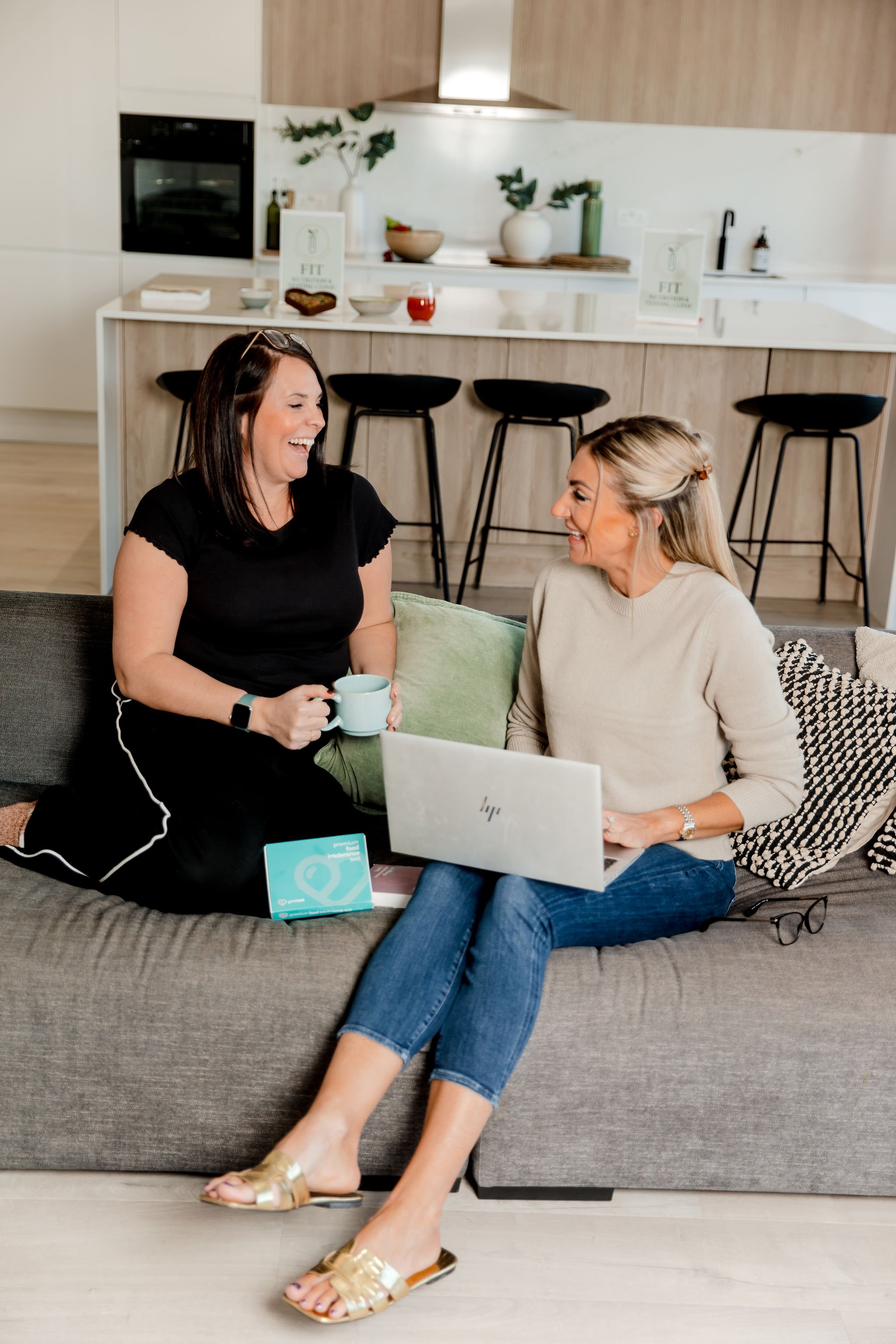 becki Hawkins and client chatting while looking at test results on laptop