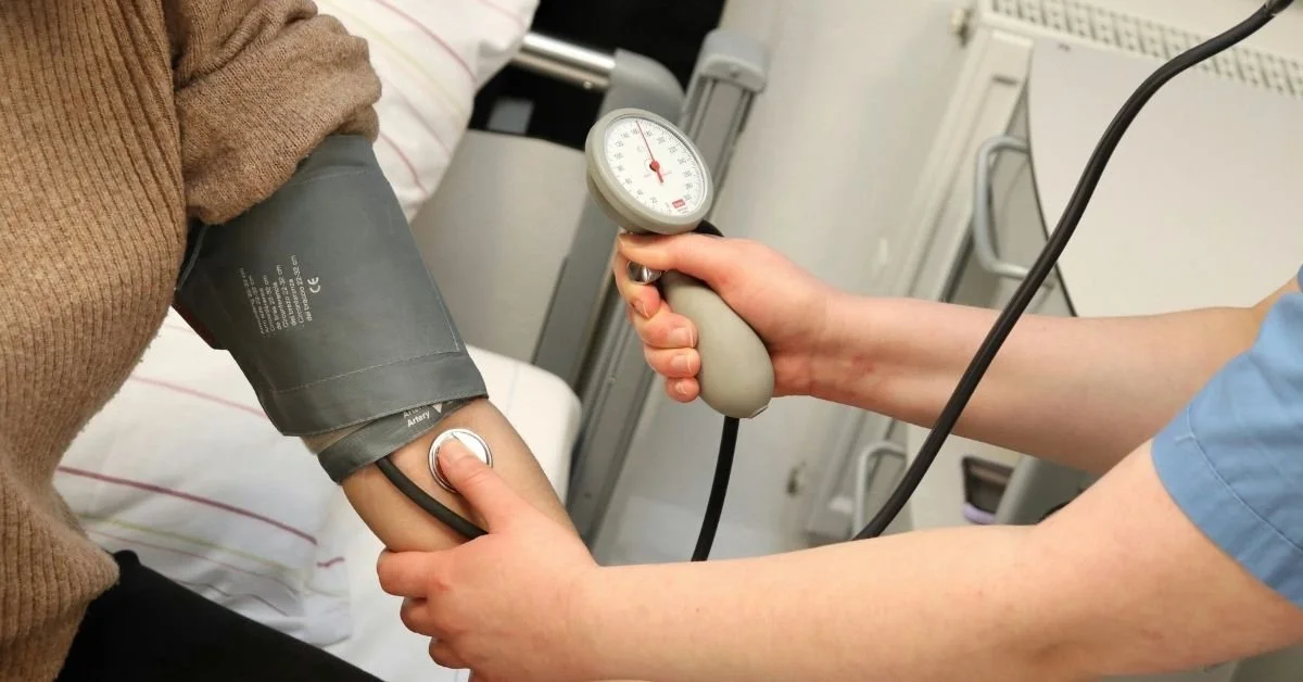 patient's blood pressure being measured