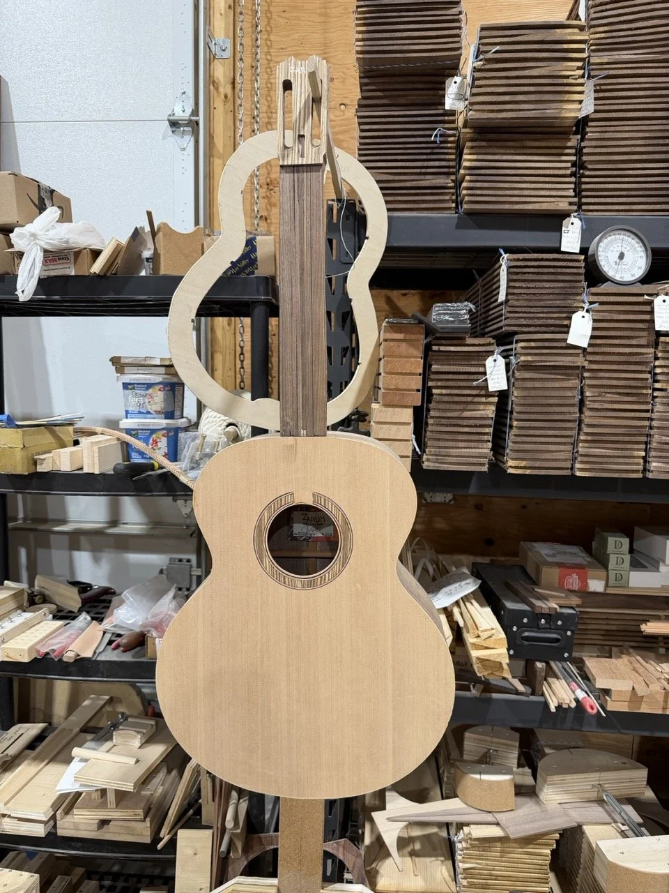 The front of the acoustic guitar after removal from the mold.