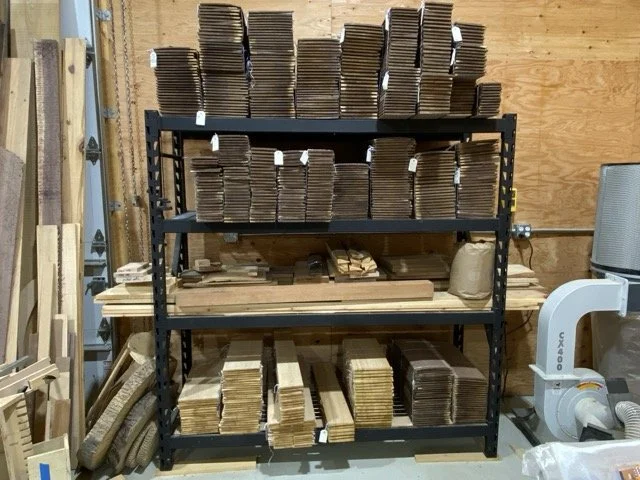 Sorted and labeled dried walnut and ash guitar sides and back