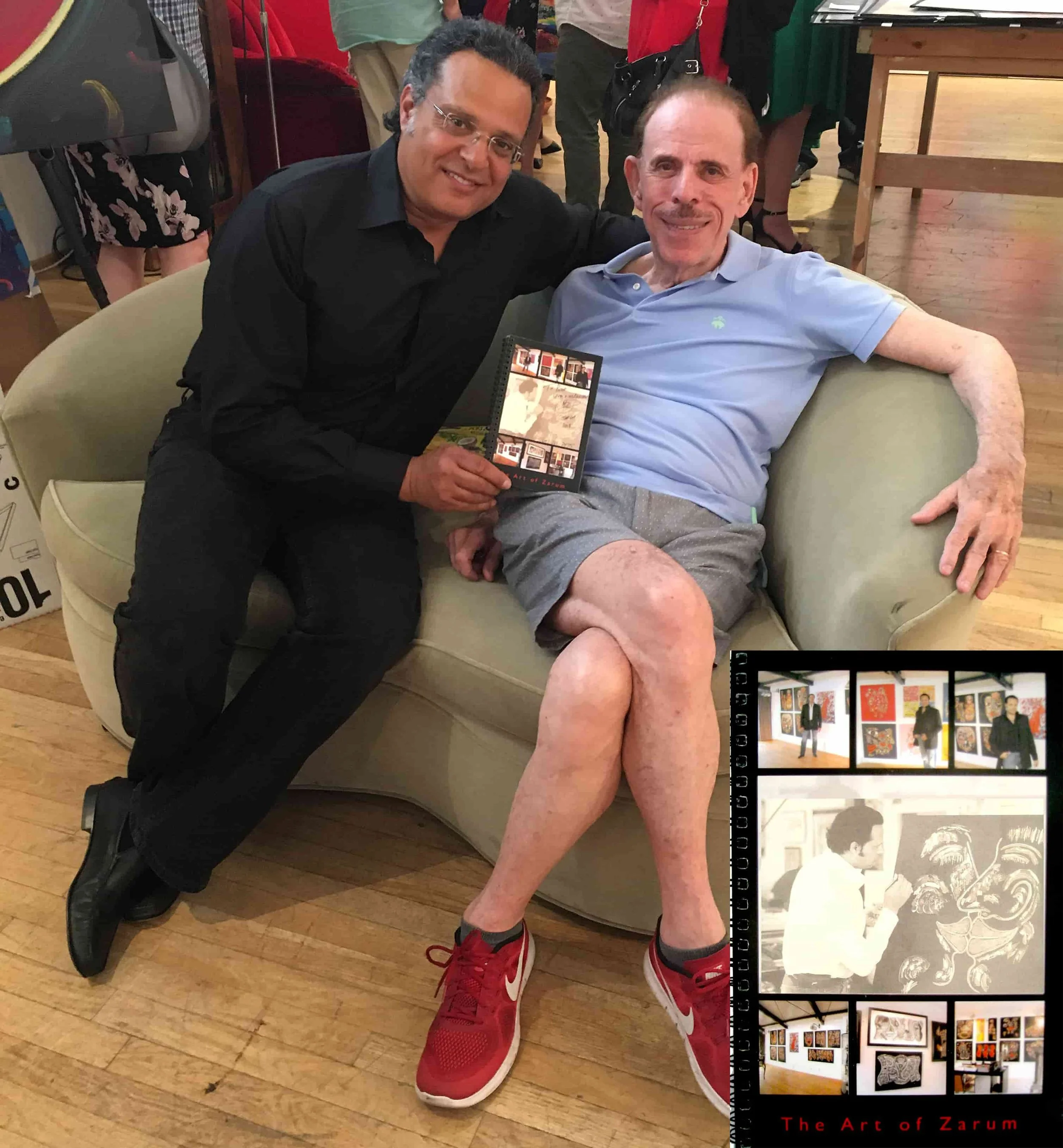 The artist ZARUM with the artist Peter Max in his New York Studio. Zarum gifts a copy of his book 'The Art of Zarum' to peter Max.
