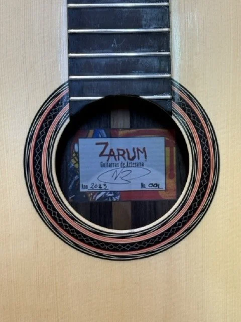 The Zarum guitar label shown through the sound hole