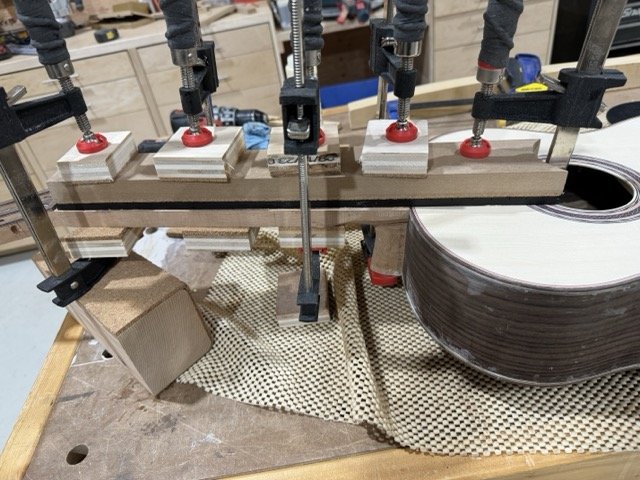 Gluing the ebony fretboard to the neck