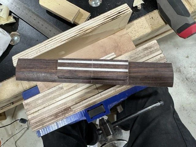 The bridge blank has been rounded and trimmed along each wing