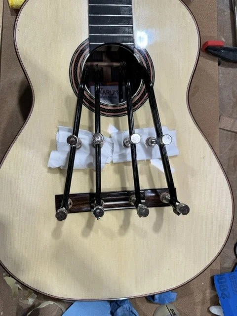 The guitar has been french polished over a period of 6 weeks and is now ready to glue the bridge to the soundboard
